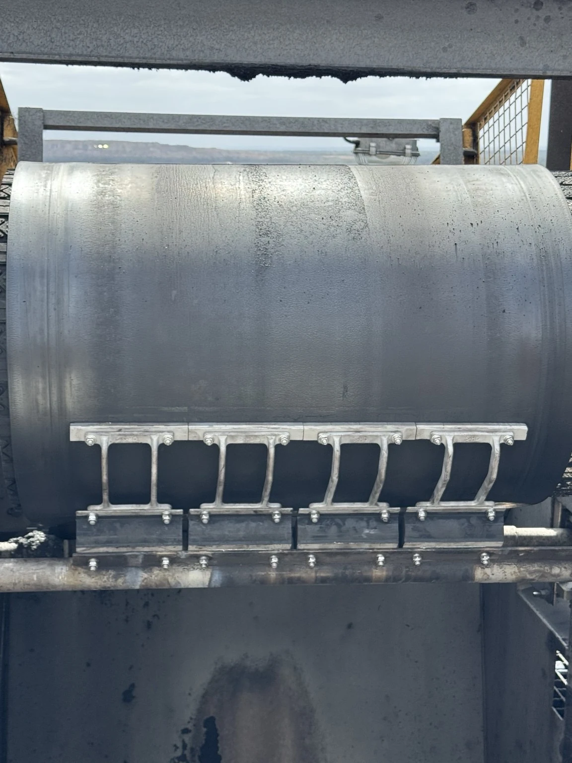 Primary Head Cleaner installed across the belt in the head chute.