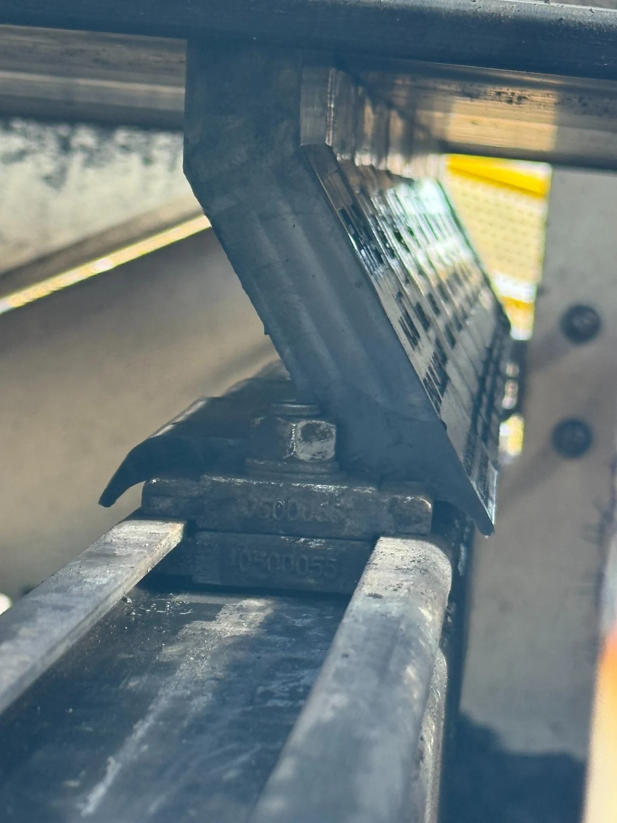 Inline secondary cleaner showing the wear segment secured to the slide frame.