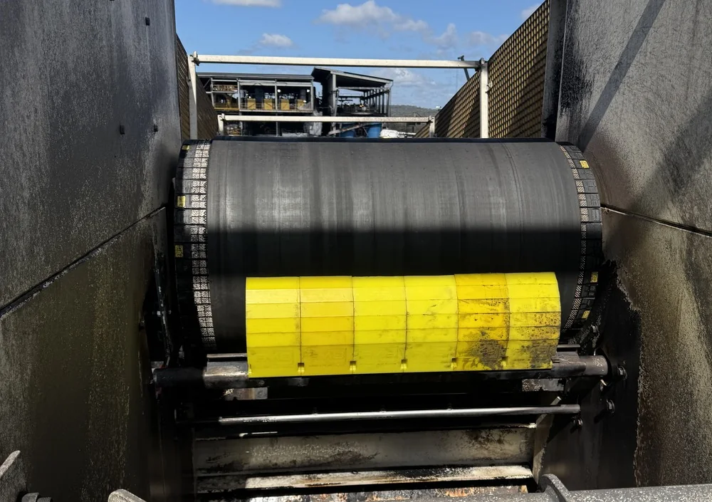 Installed belt cleaner at a conveyor pulley
