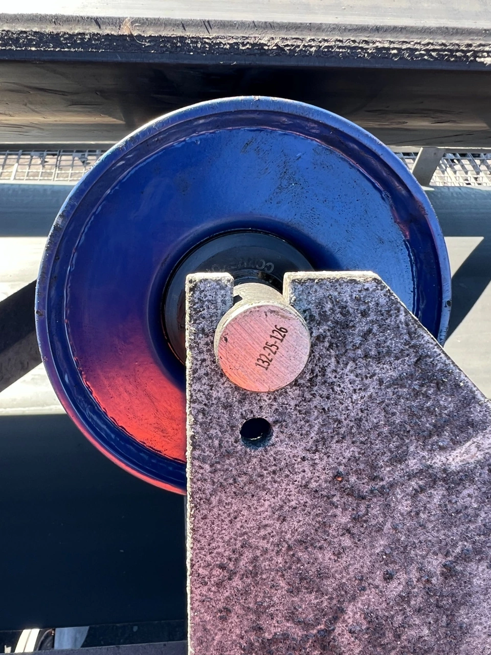 Superior steel roller shaft end mounted in a conveyor frame